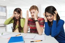 photodune-11685160-three-stress-young-students-sitting-together-isolated-m.jpg - 